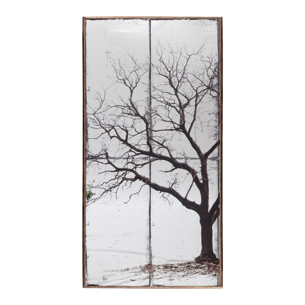 Decorative mirrored wall art with a tree design on a white background