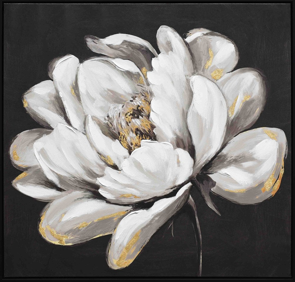 Framed artwork of a white flower with gold accents on a black background
