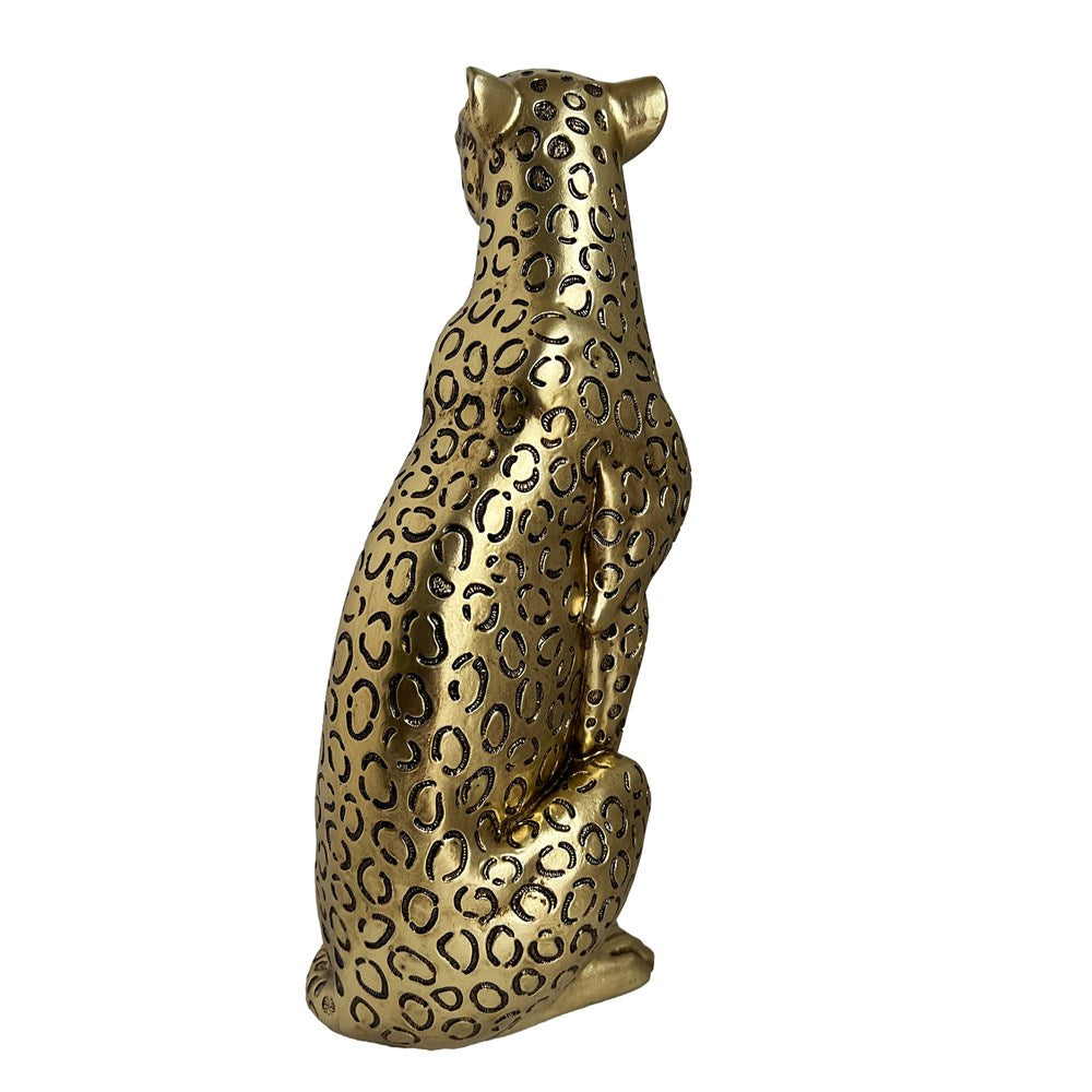 Gold leopard statue on a white background