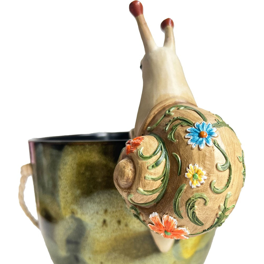 Decorative snail with floral patterns on a white background