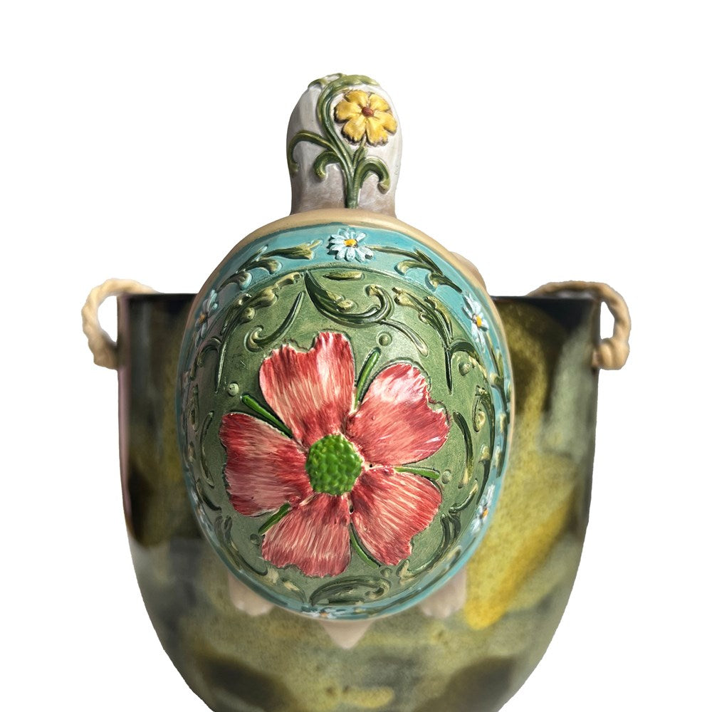 Decorative floral design on the back of a tortoise on a white background