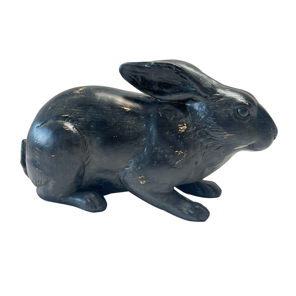 Black rabbit figurine on a white background