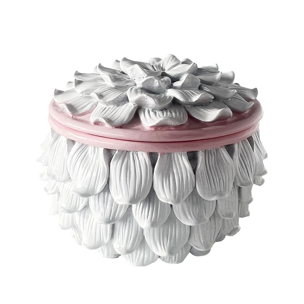 Decorative white trinket box with petal design with pink accent on a white background