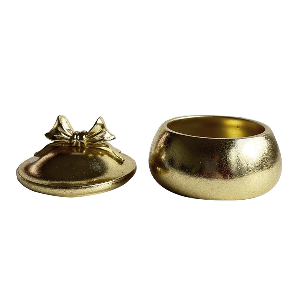 Gold decorative box with a lid ajar on a white background