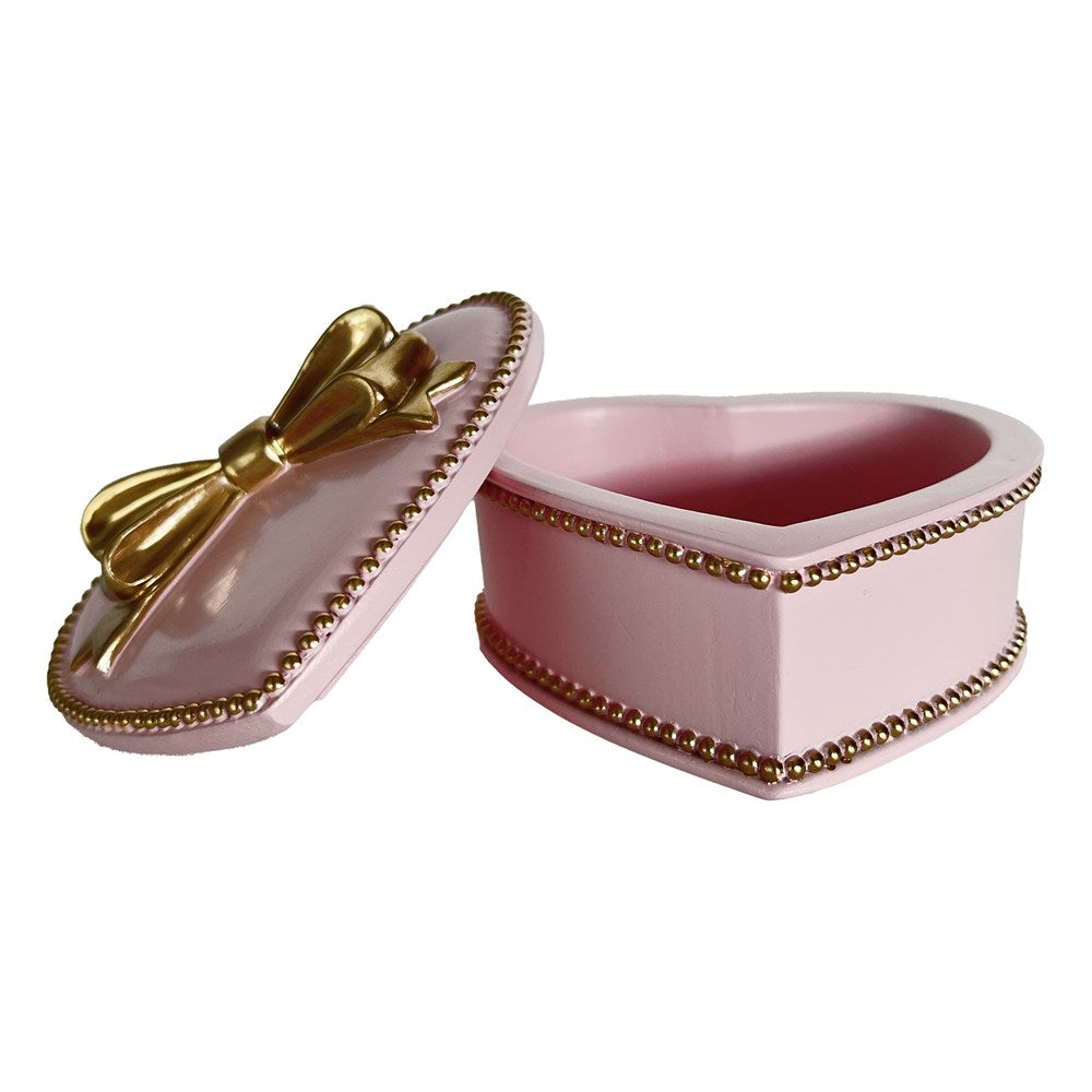 Pink heart-shaped jewelry box with gold accents on a white background