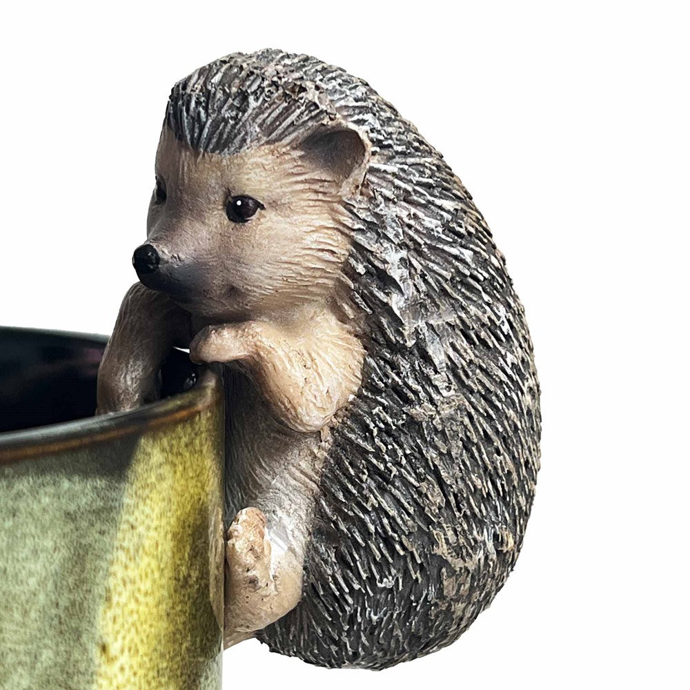 Hedgehog hanging ornament on a planter pot