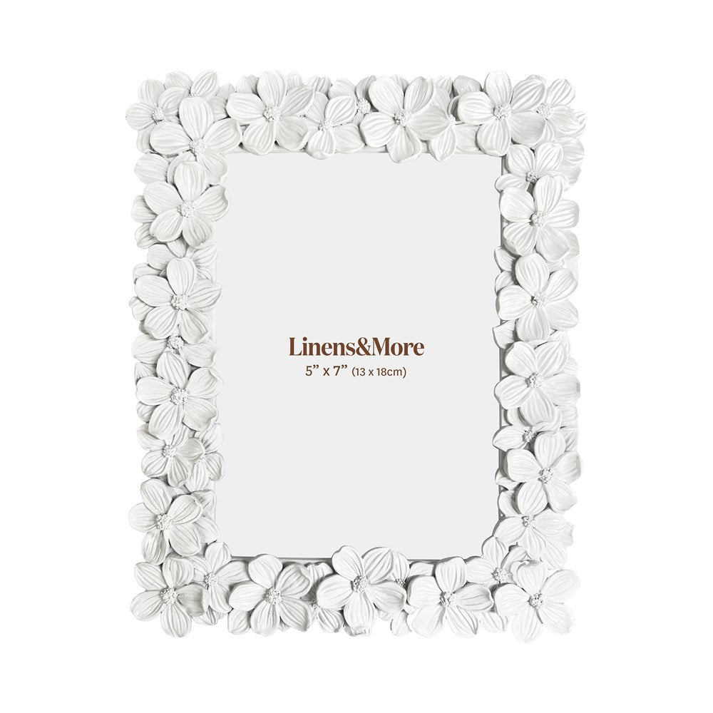 Floral photo frame with 'Linens & More' branding on a white background