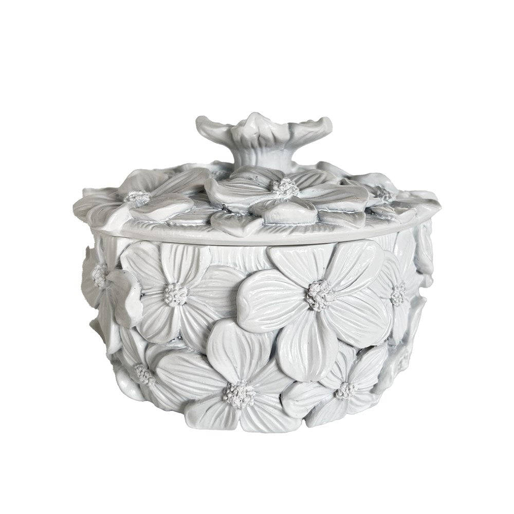 Decorative white trinket box with floral design on a white background