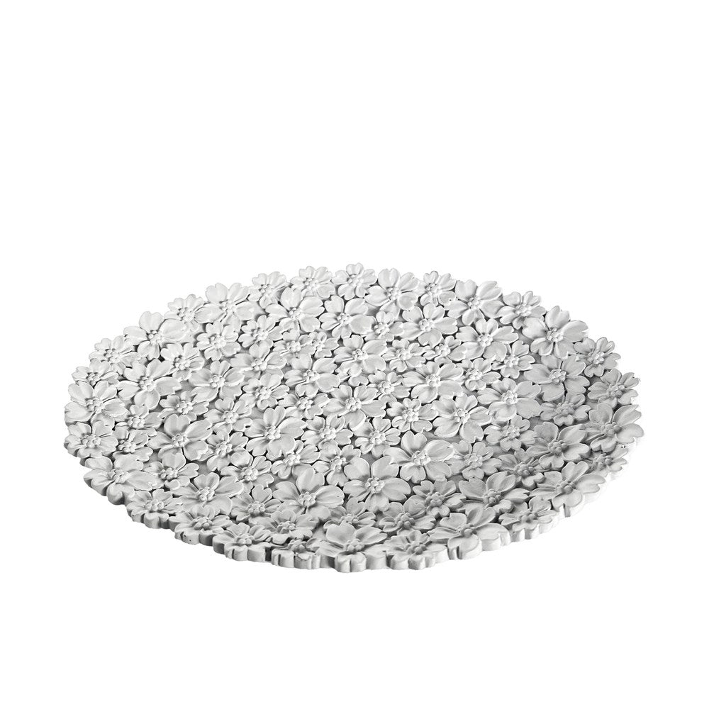 Oval flowered textured dish on a white background