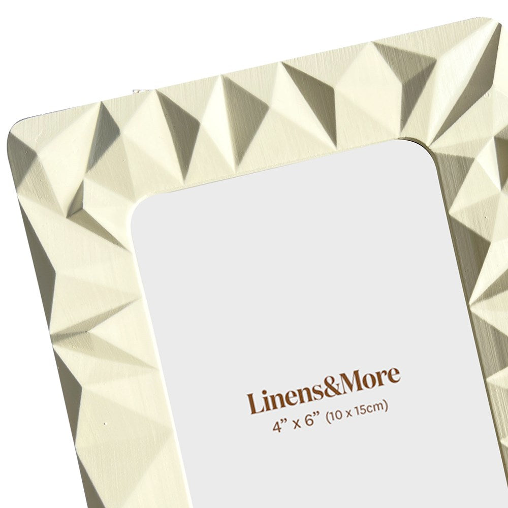 Beige geometric photo frame with a card displaying 'Linens & More' and dimensions.
