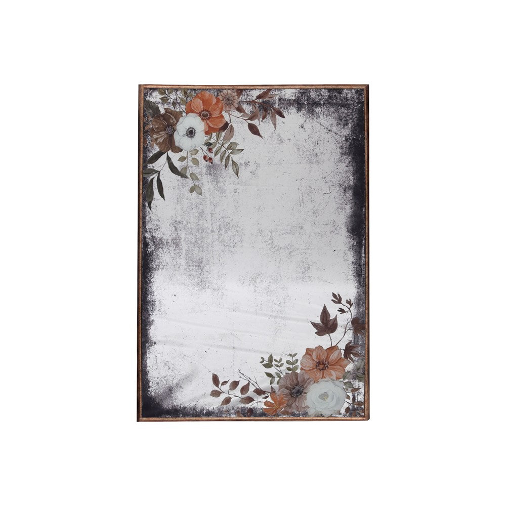 Decorative mirrored art with floral design on a white background