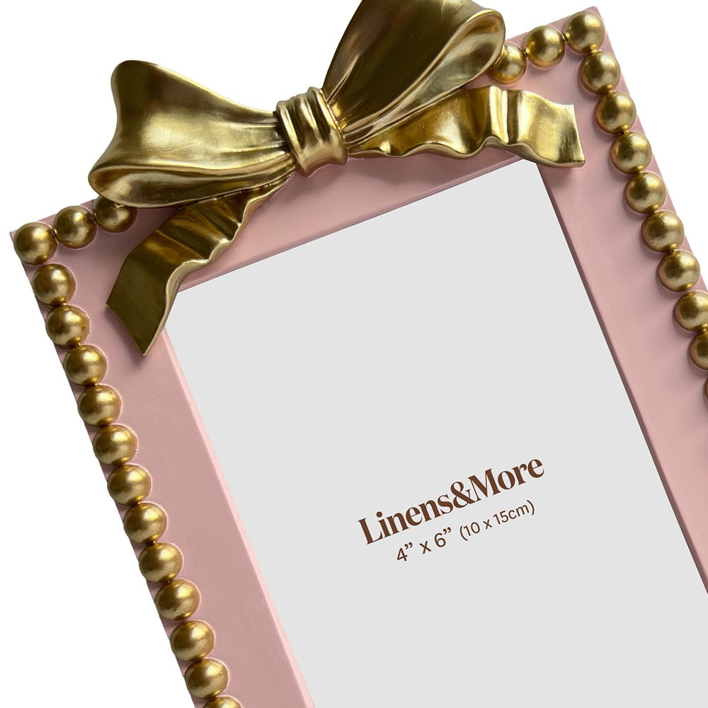 Pink picture frame with gold bow