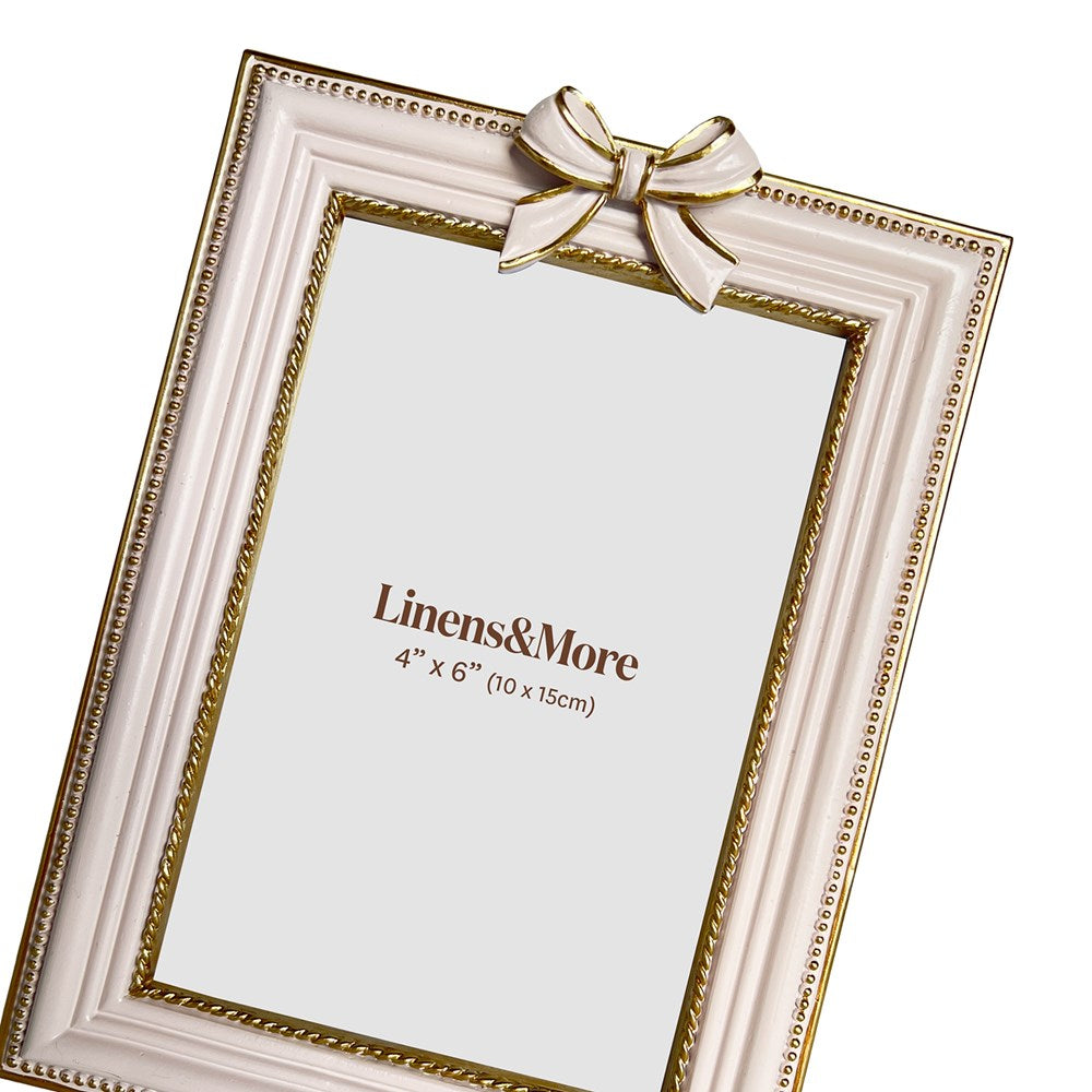 Decorative photo frame with a bow on a white background