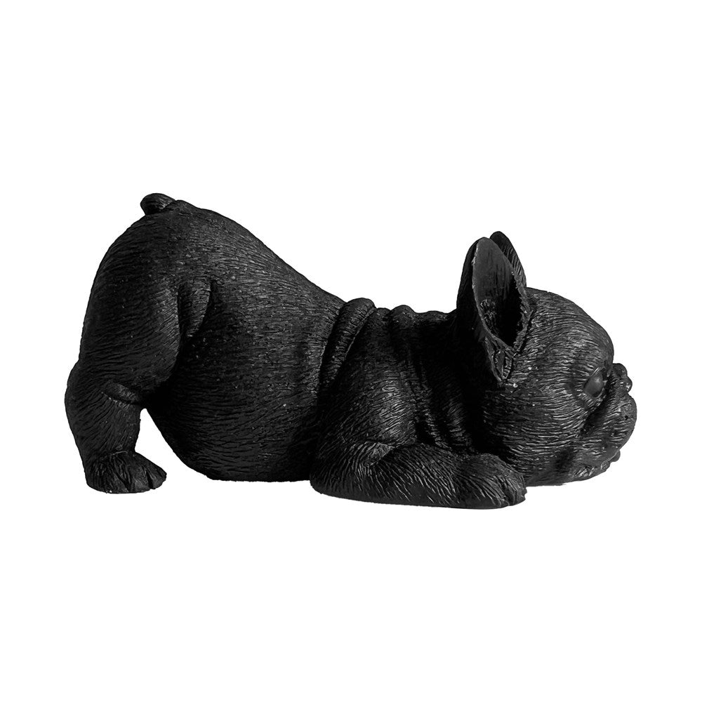 Black figurine of a dog on a white background