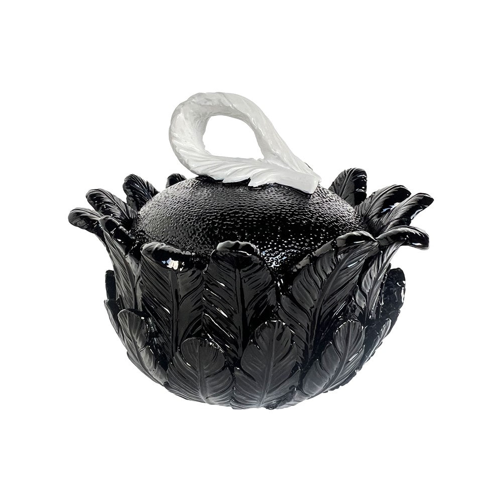Decorative black and white feathered trinket box on a white background
