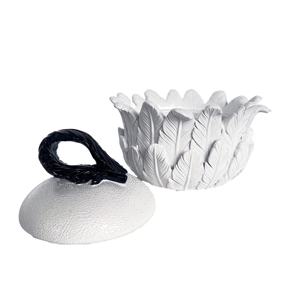 Decorative white feather design trinket box with a black handle on a white background