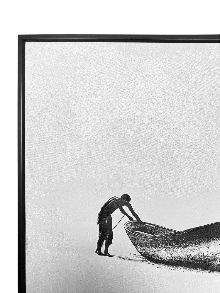 Framed black and white artwork of a person pushing a boat on a minimalistic background