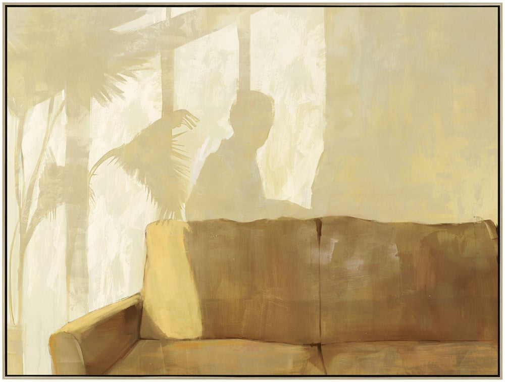 Silhouette of a person and a couch with a blurred background