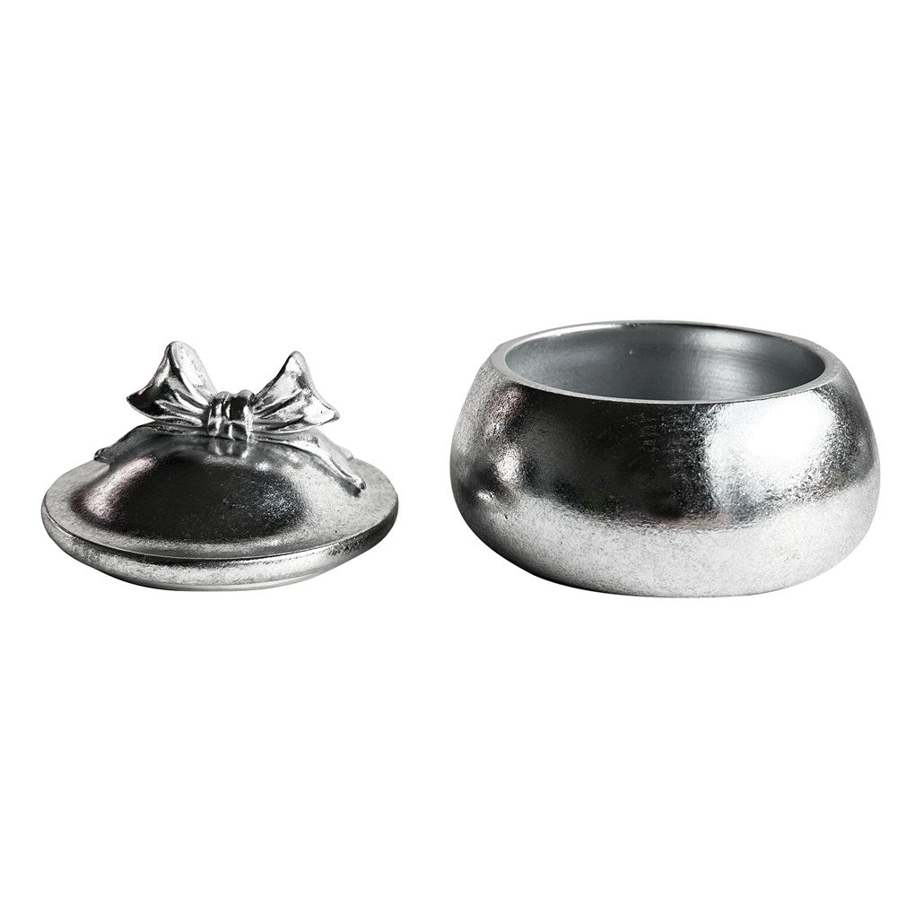 A jar silver bow lid beside silver trinket box