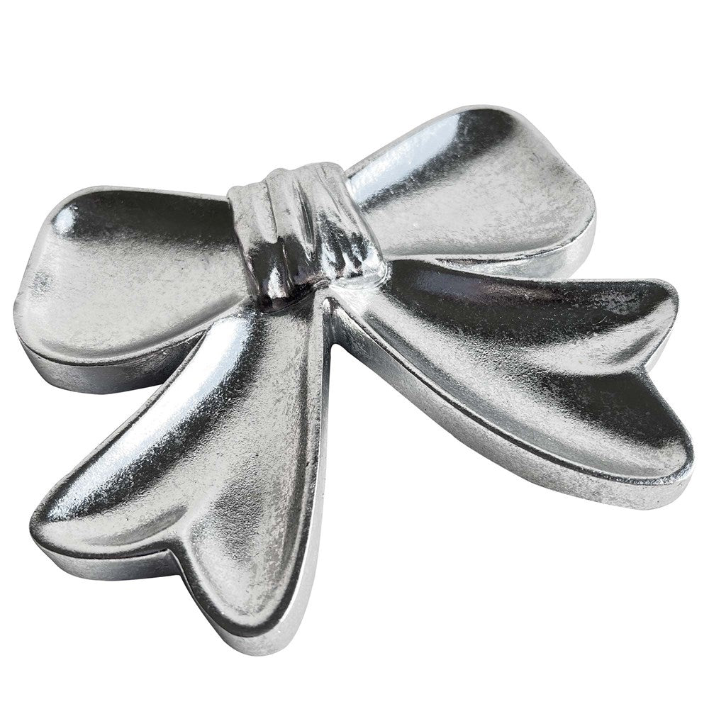 Silver bow shaped object on a white background