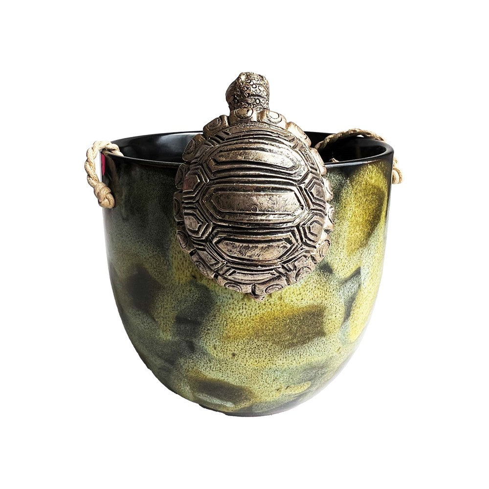 Decorative tortoise hanging on pot
