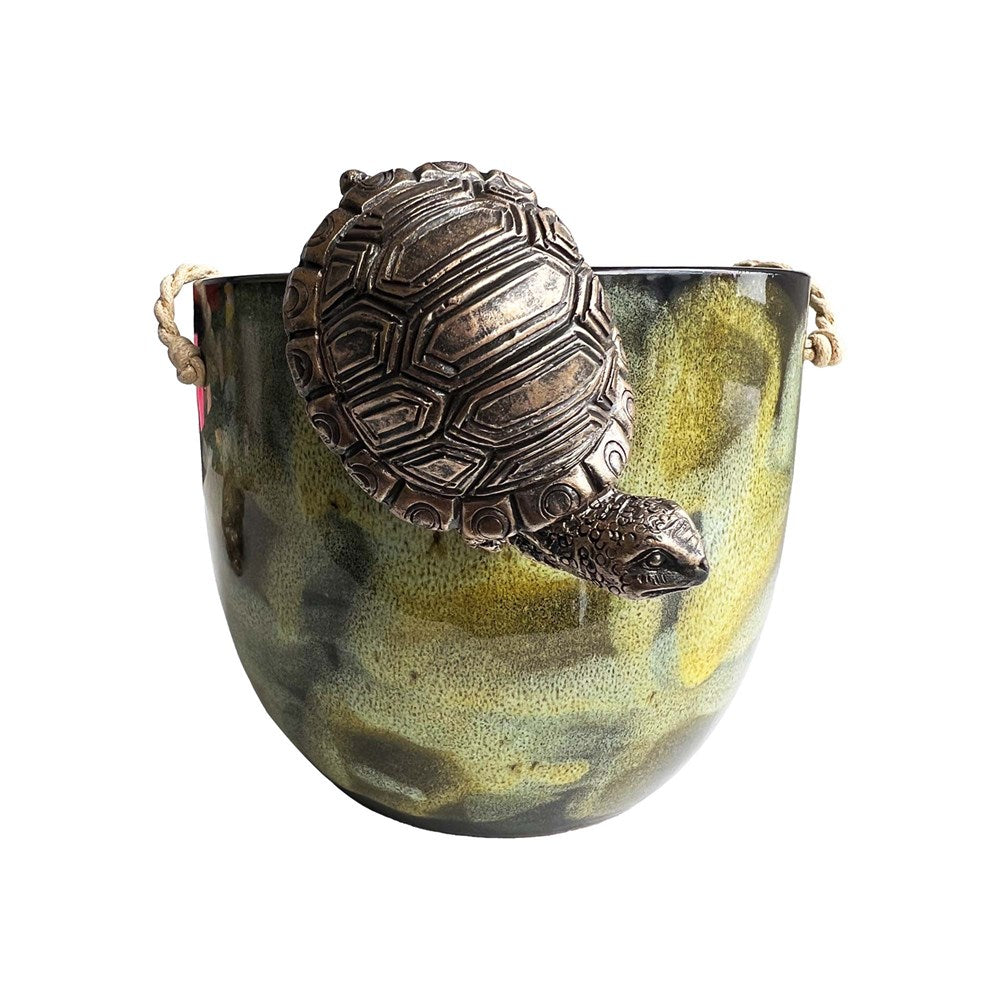 Decorative tortoise gold hanging on a pot