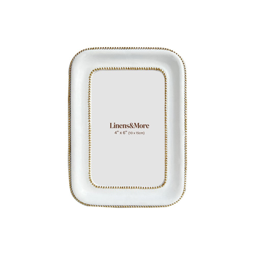 White picture frame with gold trim on a white background, featuring 'Linens&More' branding.
