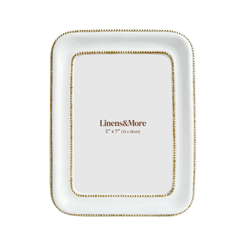 White and gold photo frame on a white background
