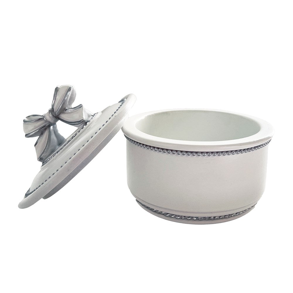 White decorative trinket box with silver elements on a white background