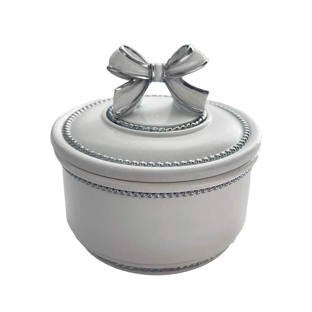White jewelry box with a silver bow on a white background